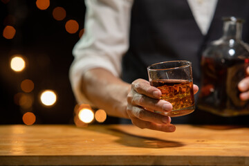 Barman pouring whiskey whiskey glass beautiful night