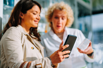Close up of pharmacist and customer using telephone.