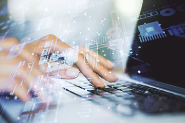 Multi exposure of abstract graphic coding sketch with hands typing on computer keyboard on...