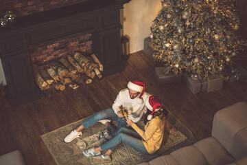 Cinematic image of a couple celebrating christmas at home.