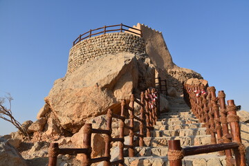 Dhayah Fort, a castle-like structure, is on the UNESCO World Heritage Tentative List and stands proud amidst the arid mountains, United Arab Emirates, Ras Al Khaimah.