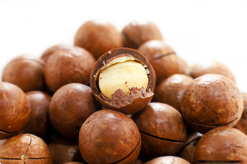 Raw macadamia nuts, heap, macro photography