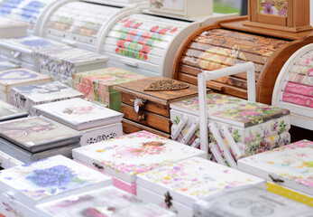 Wooden boxes decorated with decoupage technique on the market - obrazy, fototapety, plakaty