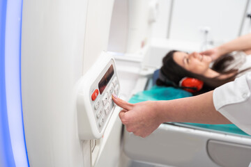 Female patient undergoing MRI - Magnetic resonance imaging in Hospital. Medical Equipment and...