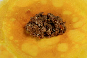 Thin pancakes with meat filling. Stuffed pancakes on a white background