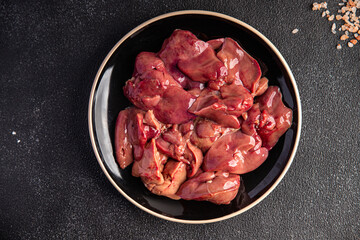chicken liver fresh raw offal delicious snack mortadella, pistachios, ham healthy meal food snack diet on the table copy space food background rustic top view