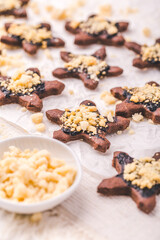 Christmas baking - homemade chocolate cookies with sprinkles and baking ingredients