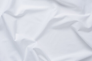 Obraz premium White fabric. luxurious white fabric texture background. Creases of satin, silk, and cotton..