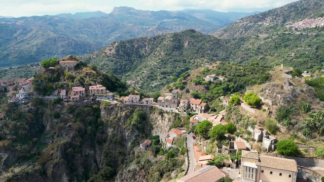 Aerial view of the small town of Savoca in Sicily. The city is located in the mountains with beautiful views of the mountain panorama. Italy