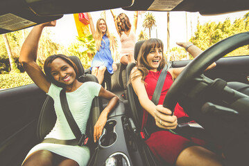 Women having fun while driving in Beverly hills