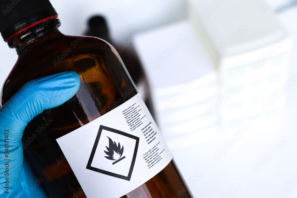 Sticker Flammable liquid symbol on the chemical bottle