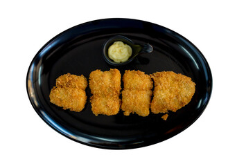 Top view of Dolly Fish Steak with Apple Cream Salad in black plate, focus selective