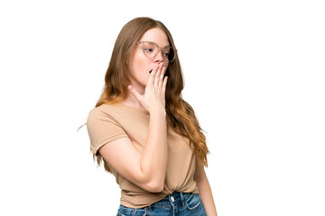 Fototapeta premium Young pretty woman over isolated background yawning and covering wide open mouth with hand