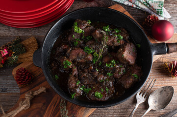 Christmas meat dish with braised pork tenderloin medallions and red onions sauce