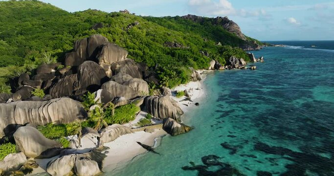 Aerial panning view of the spectacular Anse Source d'Argent beach, La Digue,Seychelles