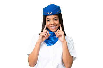 Airplane stewardess African american woman over isolated background smiling with a happy and...
