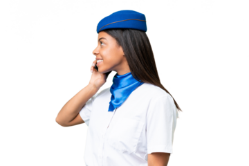 Airplane stewardess African american woman over isolated background keeping a conversation with the mobile phone with someone