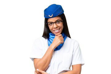 Airplane stewardess African american woman over isolated background with glasses and smiling
