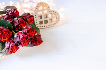 Festive background for Valentine's Day with a bouquet of red roses, copy space.