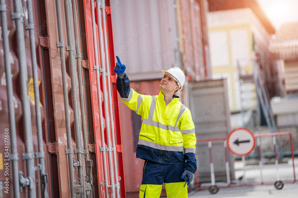 Poster Engineer or foreman checking about shipping of container box in warehouse stock yard.