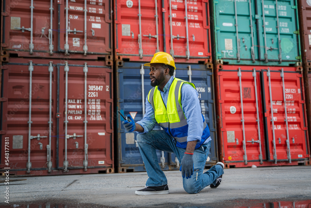 Poster Engineer or foreman checking inventory or job details with cargo container background,Logistic import export working concept.