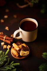 Mug of hot chocolate and Christmas decorations