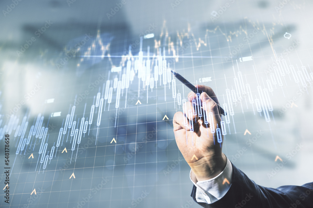 Poster multi exposure of trader hand with pen working with virtual abstract financial chart and world map o