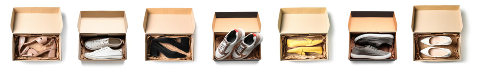 Set of cardboard boxes with stylish shoes isolated on white, top view