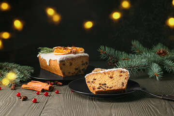 Tasty Christmas stollen on wooden table
