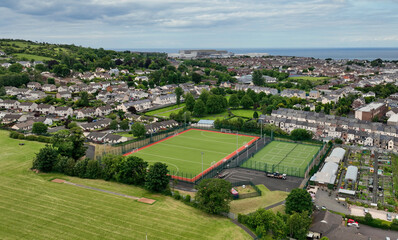 Fototapeta na wymiar Aerial photo of the grass and 3g Playing fields at Larne Grammar School in Larne Co Antrim Northern Ireland
