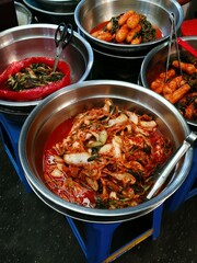 Silver pot of kimchi on display for sale in South Korean street market