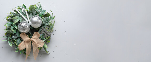 Stylish Christmas wreath on light background with space for text, top view