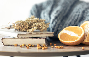 Cozy home composition with books on the table close-up.