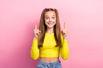 Photo of cheerful cute girlfriend two arm direct empty space offer discount novelty recommend proposition isolated on pink color background