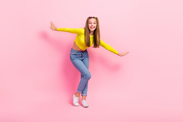 Full length photo of excited dreamy school girl dressed yellow crop top dancing closed eyes...