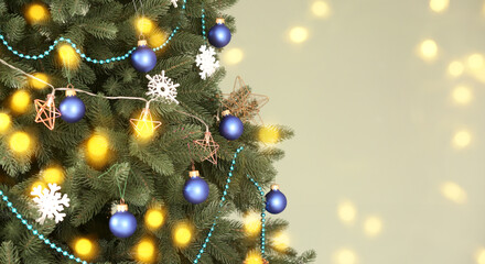 Beautiful Christmas tree on light background with space for text, closeup