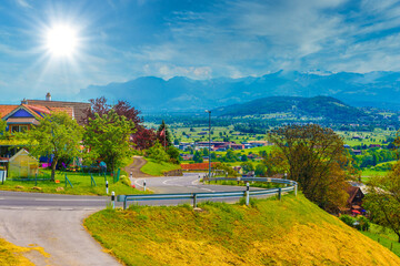 Curved road in Alps village, Grabs, Werdenberg, St. Gallen, Swit