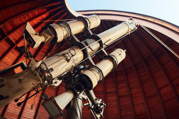 Big astronomical telescope in observatory for science research od space and celestial objects.
