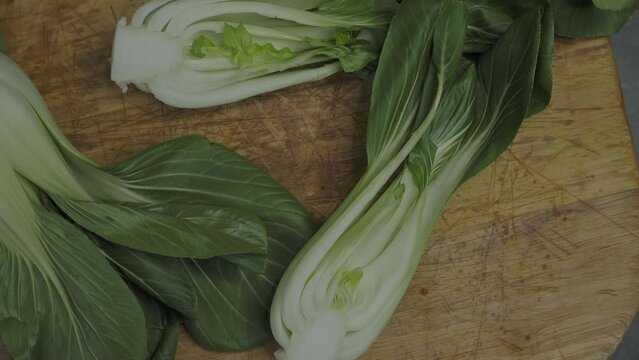 Endives on a wooden cutting board (Cichorium intybus). Fresh chicories
