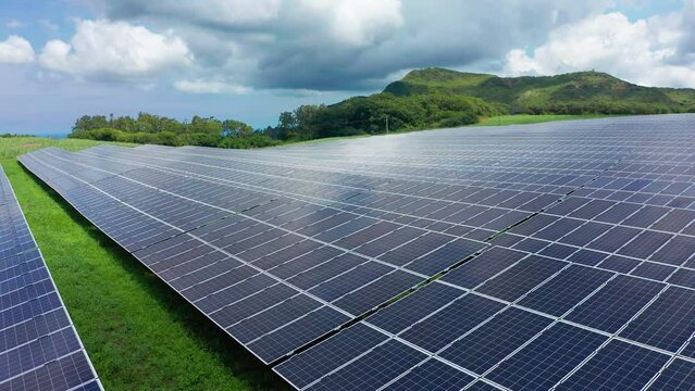 Solar panels to generate electricity on a green island. Renewable Energy Theme. Environmentally friendly electricity