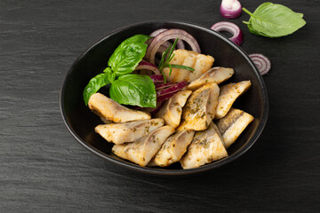 Salted Herring Fillet, Raw Pickled Fish Meat, Marinated Herring on Black Background