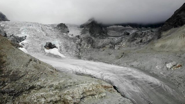 Aerial flyover towards the Moiry glacier near Grimentz in Valais, Switzerland