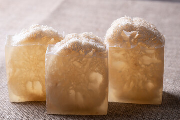 Soap with loofah sponge inside. Glycerin soaps with natural scrub.