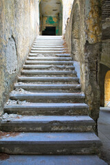 Fototapeta na wymiar Lost Place in Eleousa. Derelict sanatorium. Historical Italian settlement. Detail view of an old staircase. Rhodes, Greece.