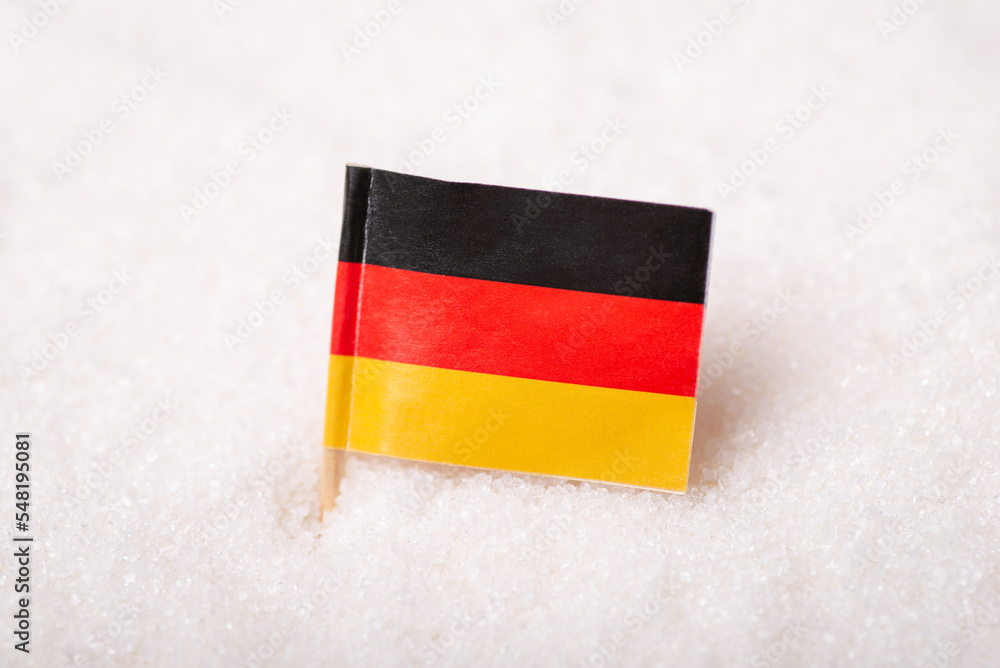 Poster Flag of Germany in sack of sugar. Concept of German sugar, export, import of product