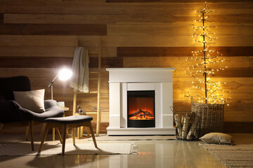 Fototapeta premium Interior of dark living room with fireplace, glowing lamps and ladder