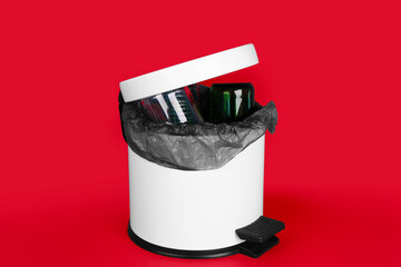 Open rubbish bin with trash on red background