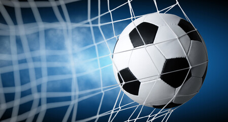 Soccer ball in goal on blue