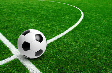 Soccer ball on stadium field texture