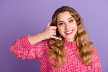 Fototapeta premium Portrait of nice cheerful girl showing gesture phone hot line center roaming isolated on violet color background